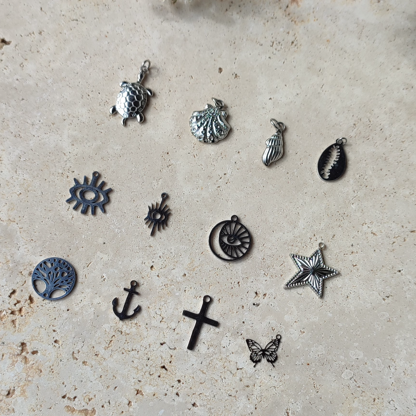 Nos charms en acier inoxydable argenté