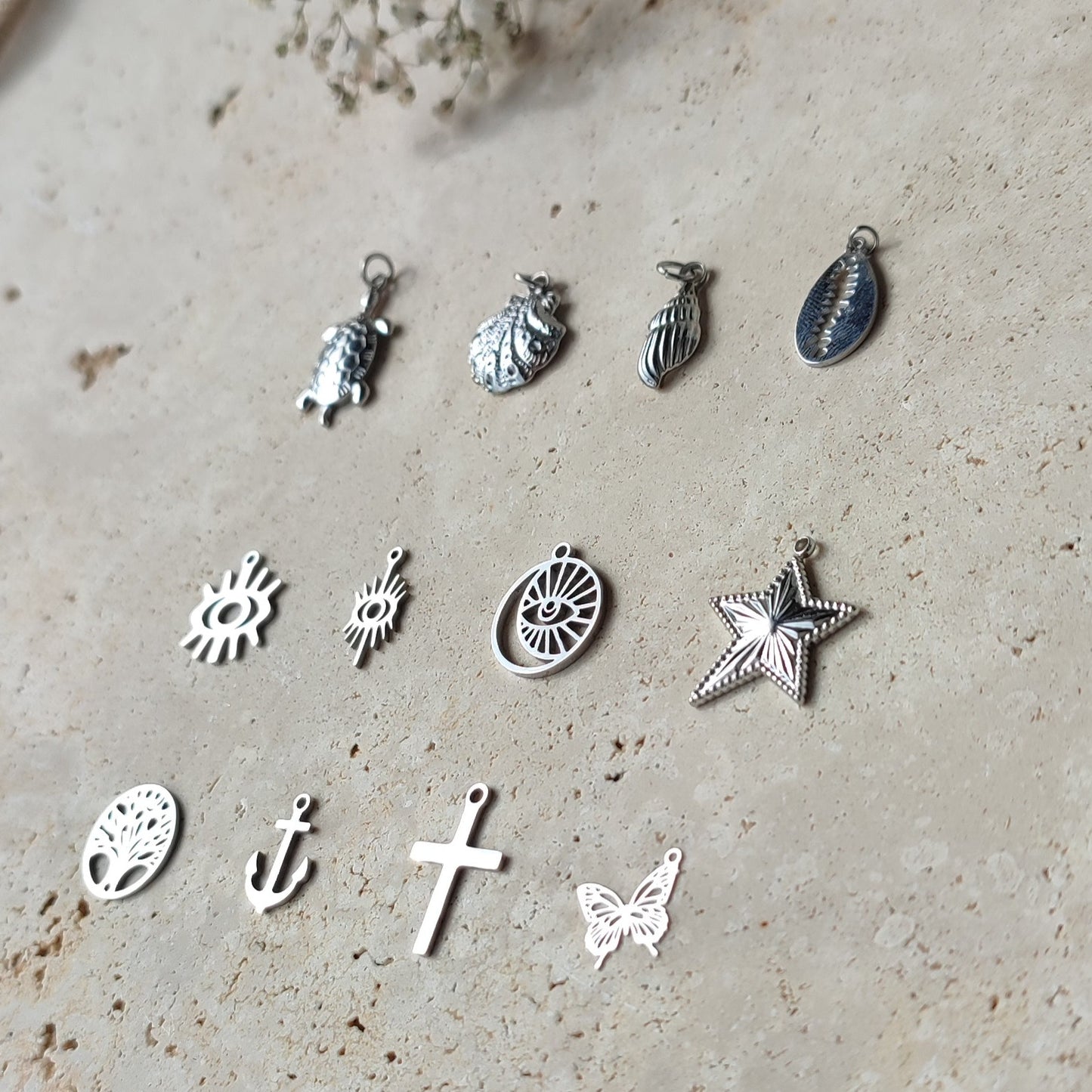 Nos charms en acier inoxydable argenté